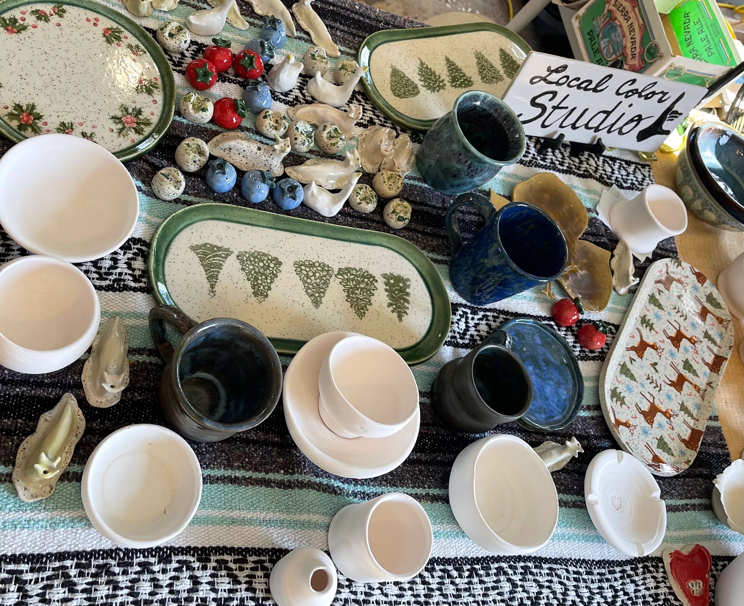 Handmade pottery from Local Color Studio on display